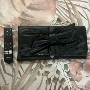 Oversized black faux leather (or real leather) bow clutch bag with leopard print